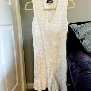 Form fitting knee length European size 38=size 0/2. Stretch fabric.